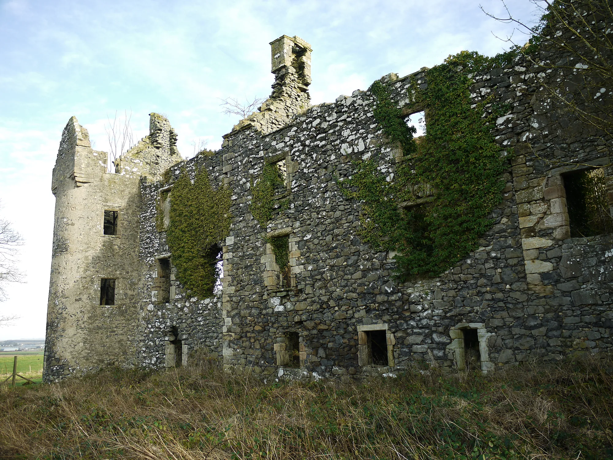 Auchans Castle round tower and ivy-covered roofless walls