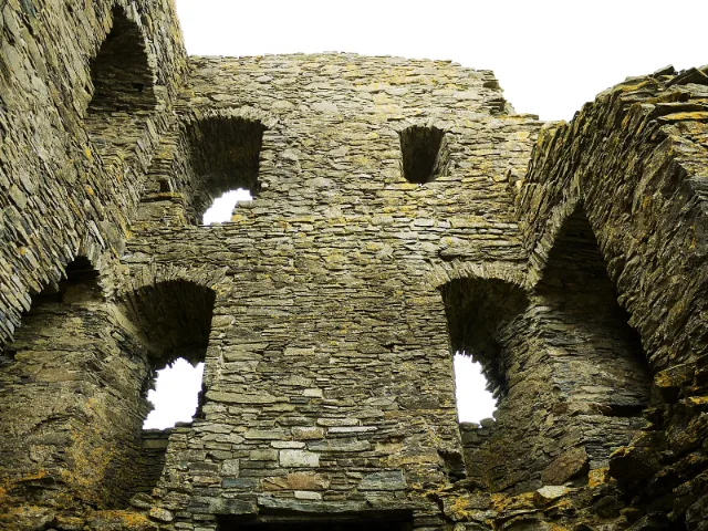 Auchindoun Castle: ruined interior walls with arches and windows