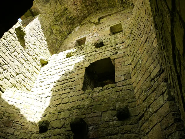 Light falling into a roofless stone chamber at Hermitage Castle