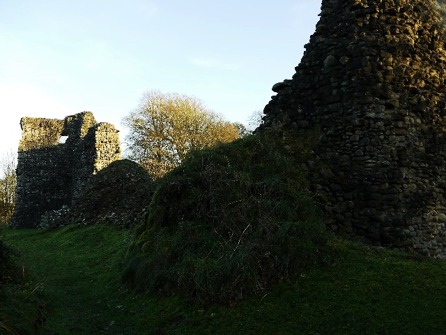 Grassy slope between broken stone walls — Lochmaben Castle