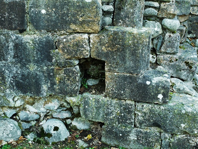 Close view of stonework with a small square recess — Lochmaben Castle